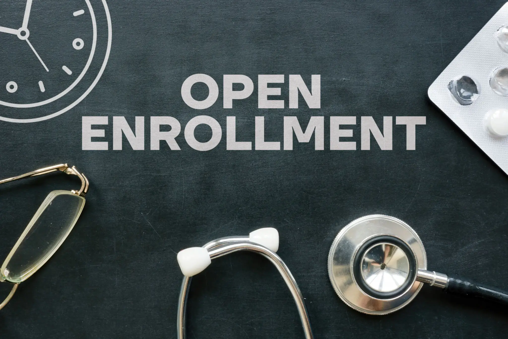 task18 A chalkboard with the words open enrollment written in it.